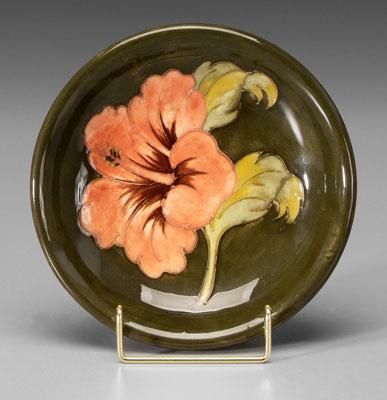 Appraisal: Moorcroft shallow bowl flower probably hibiscus on olive ground base