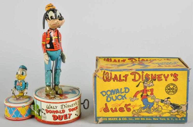 Appraisal: Tin Marx Disney Donald Duck Duet Wind-Up Toy Description American