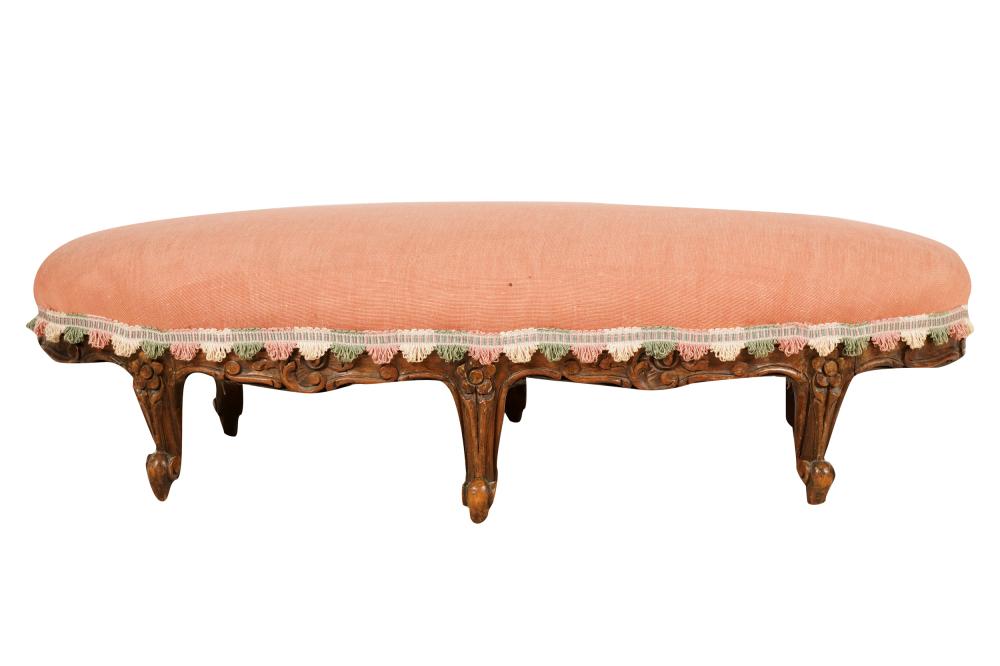 Appraisal: FRENCH PROVINCIAL CARVED WOOD FOOTSTOOLoval-shaped covered with pink linen cotton