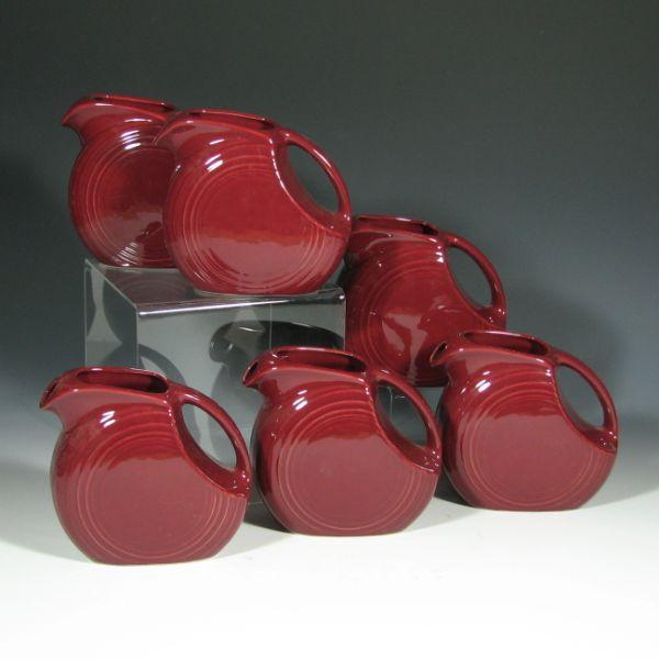 Appraisal: Six Fiesta small disk pitchers in Cinnabar All marked HLC