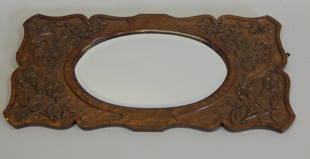 Appraisal: An early to mid- thC rectangular oak mirror carved with