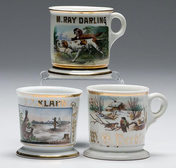 Appraisal: THREE HUNTERS' OCCUPATIONAL SHAVING MUGS including one porcelain with polychrome