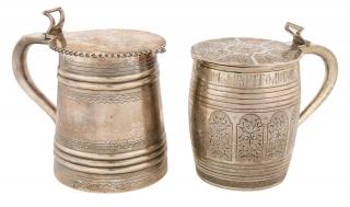 Appraisal: A PAIR OF RUSSIAN SILVER STEINS WITH HINGED COVERS IN