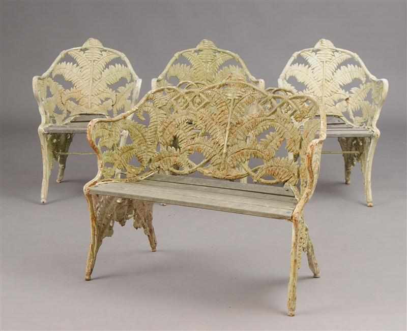 Appraisal: WHITE-PAINTED CAST-IRON TWO-SEAT GARDEN BENCH AND THREE MATCHING ARMCHAIRS Each