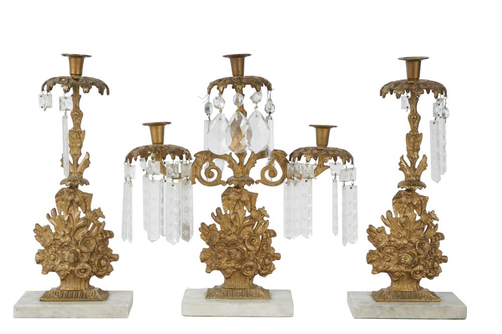 Appraisal: VICTORIAN GILT METAL THREE-PIECE GARNITUREcomprising two candlesticks and a three-light