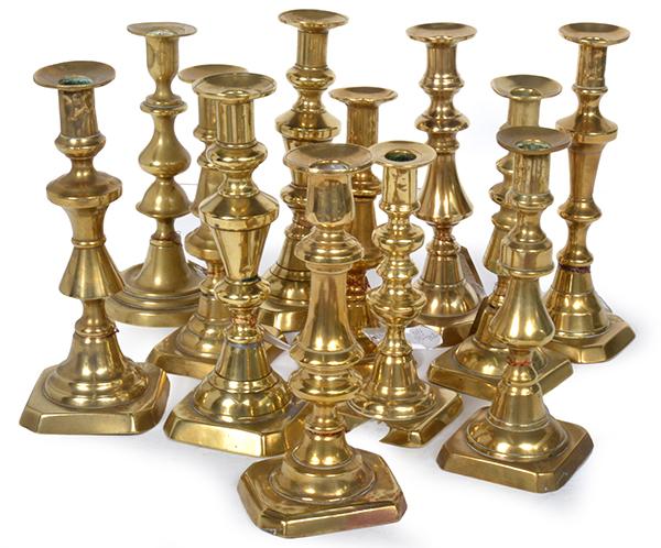 Appraisal: A COLLECTION OF TWELVE BRASS CANDLESTICKS of similar styles various