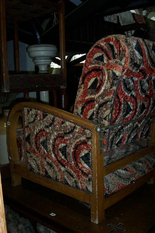 Appraisal: An Art Deco period reclining armchair with original stylised upholstery