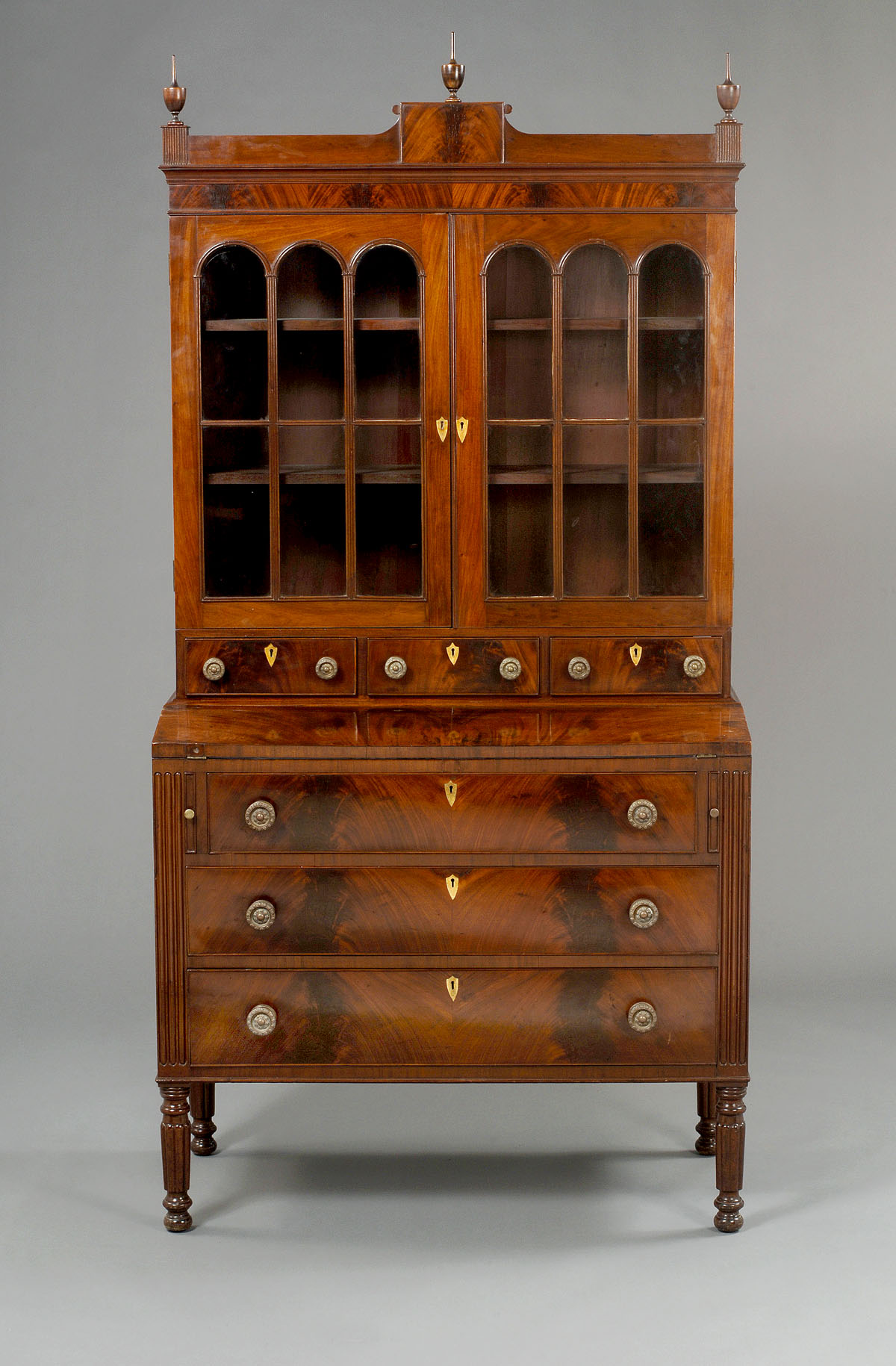 Appraisal: MASSACHUSETTS SHERATON MAHOGANY SECRETARY BOOKCASE The stepped tablet crest centering