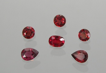 Appraisal: A Lot of Eight Unmounted Orange-Red Sapphires A group of