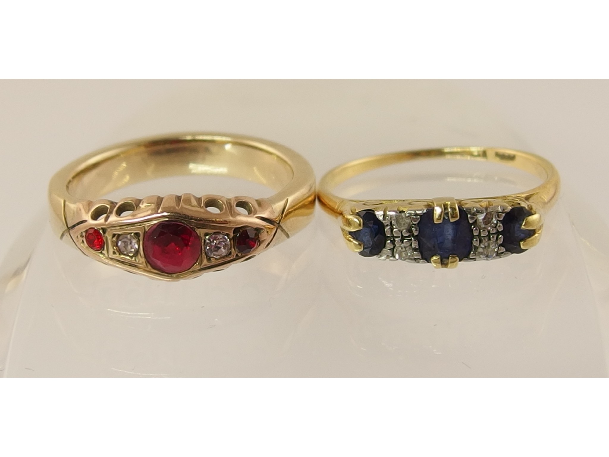 Appraisal: An ct sapphire and diamond ring and a red gem