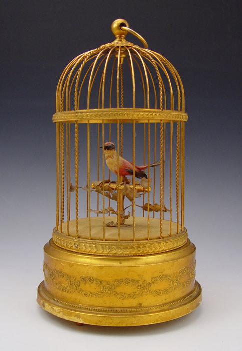 Appraisal: REUGE SWISS SINGING BIRD AUTOMATON Single feather covered automated bird