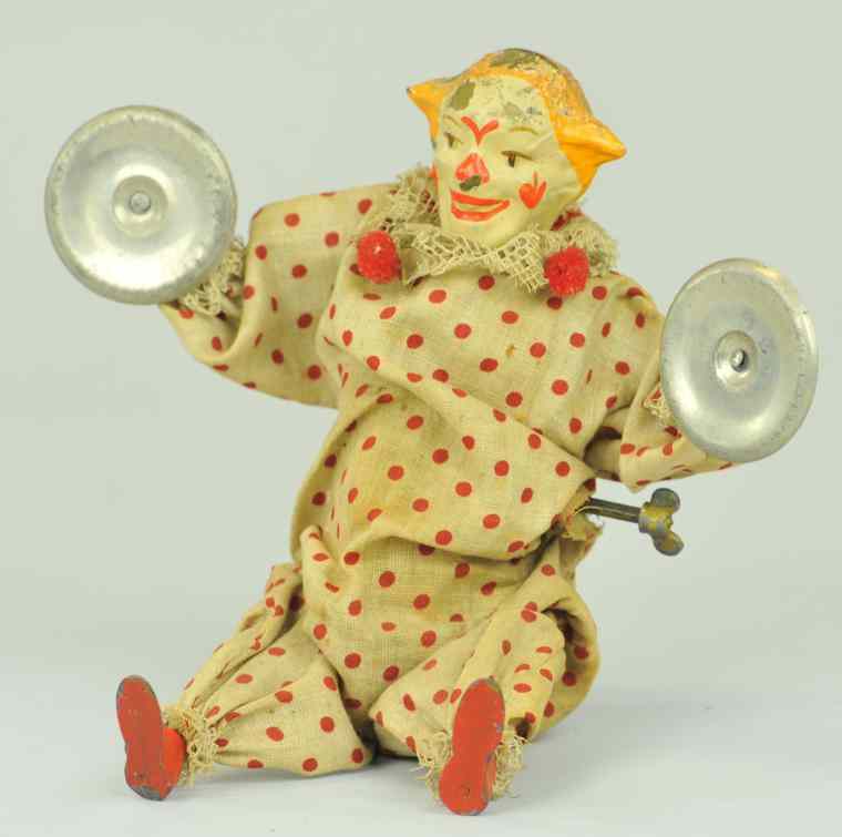 Appraisal: CLOWN WITH CYMBALS Hand painted tin head colorful facial detail