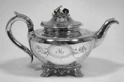 Appraisal: An early Victorian silver bulbous teapot and cover with floral