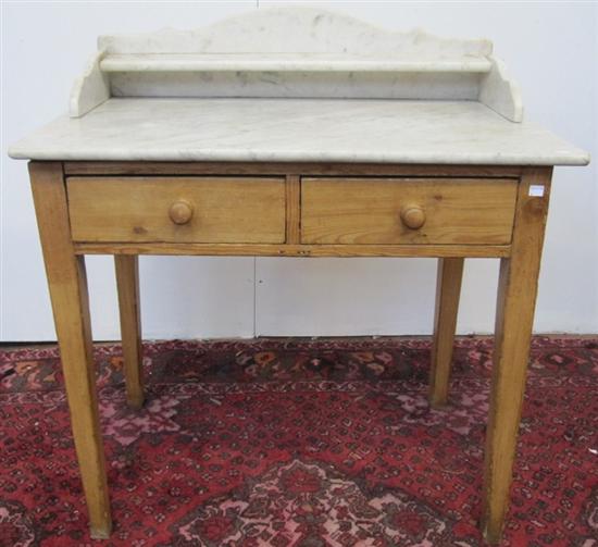 Appraisal: WASHSTAND An antique English white marble top scrubbed pine wash