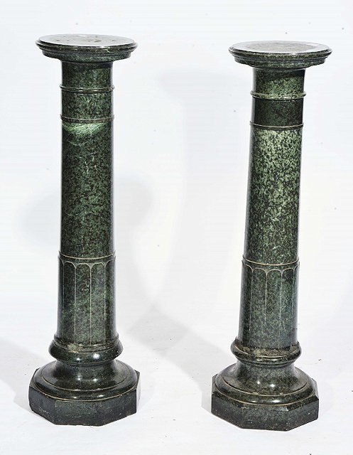 Appraisal: A PAIR OF GREEN VARIEGATED MARBLE COLUMNS of classical tapering