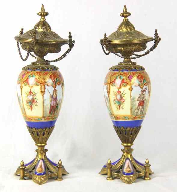 Appraisal: A pair of ormolu mounted porcelain urns painted with medieval