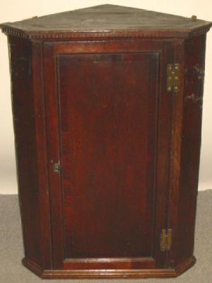 Appraisal: A GEORGE III OAK CORNER CUPBOARD early th century with