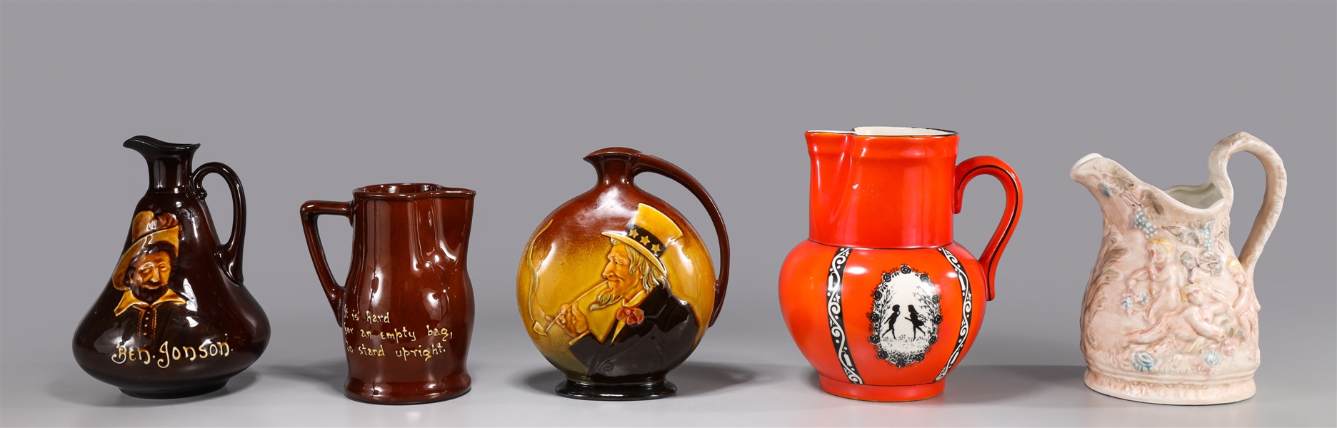 Appraisal: Group of five decorative pitchers and ewers molded ewer with