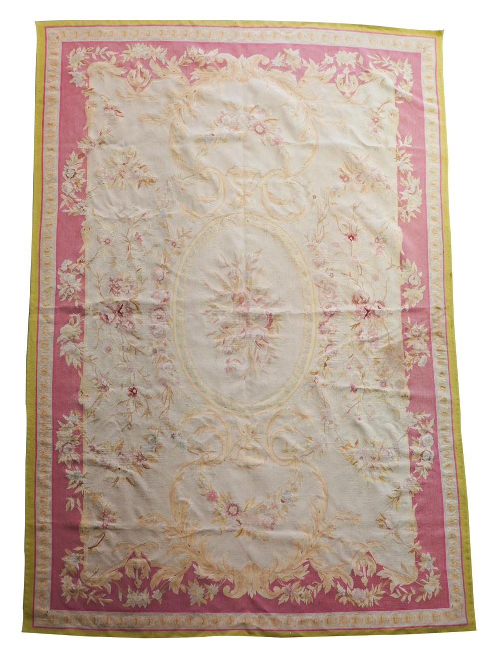 Appraisal: CONTINENTAL AUBUSSON-STYLE TAPESTRY RUGwith pink border Condition scattered small stains