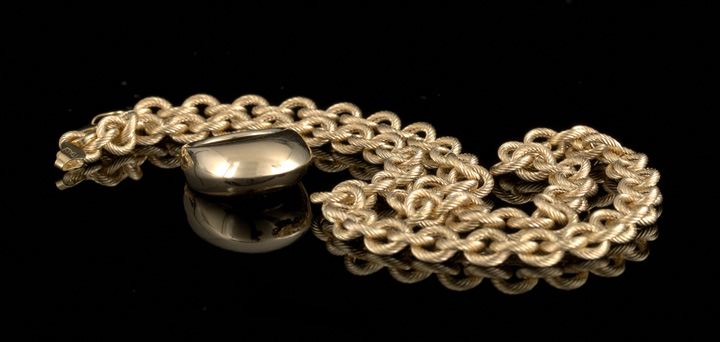 Appraisal: Italian Fourteen-Karat Yellow Gold Chain and Dome Ring composed of