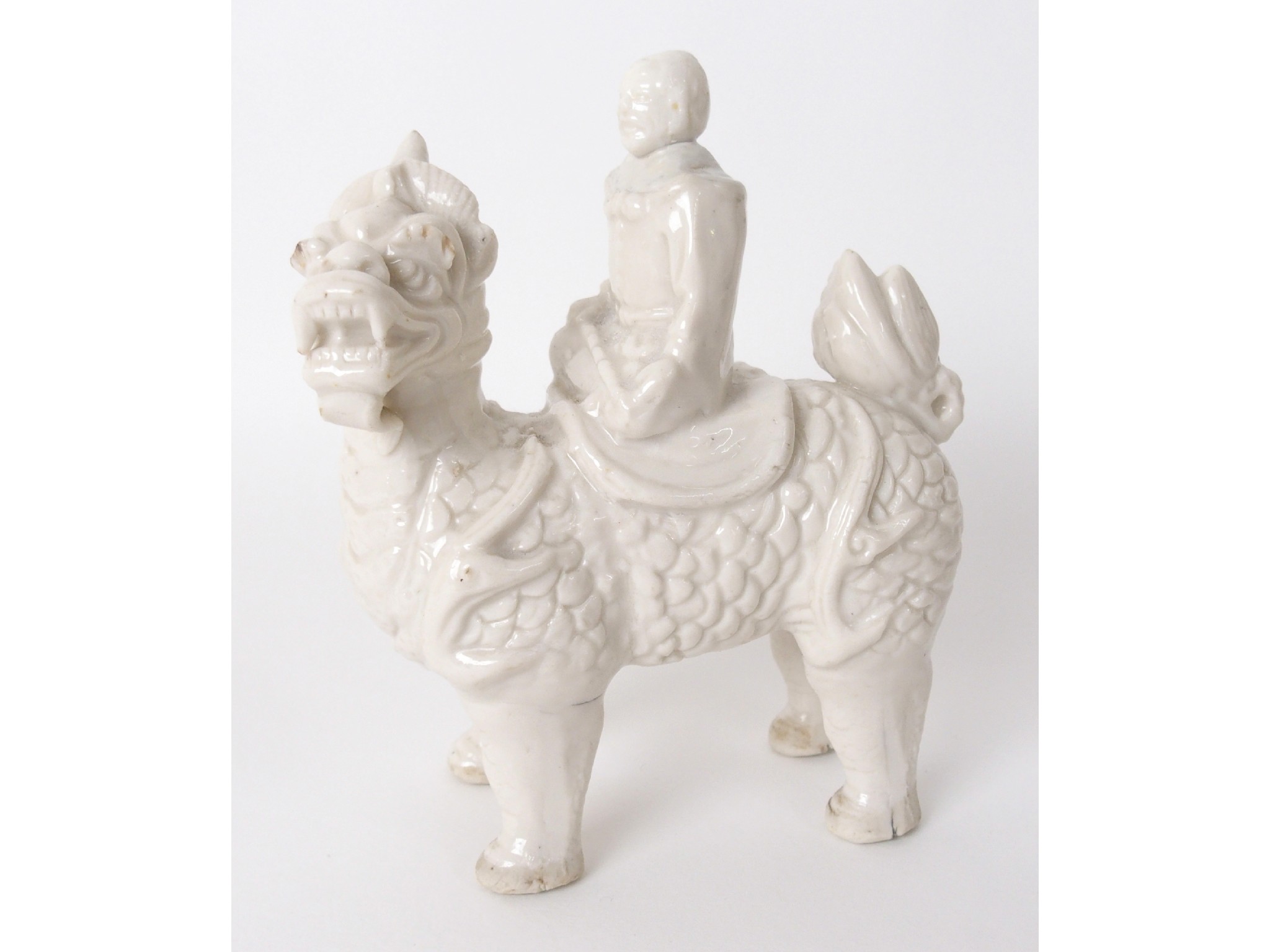 Appraisal: A Chinese blanc de chine model of a karashishiwith figure