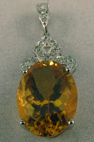 Appraisal: CITRINE DIAMOND AND FOURTEEN KARAT WHITE GOLD PENDANT set with