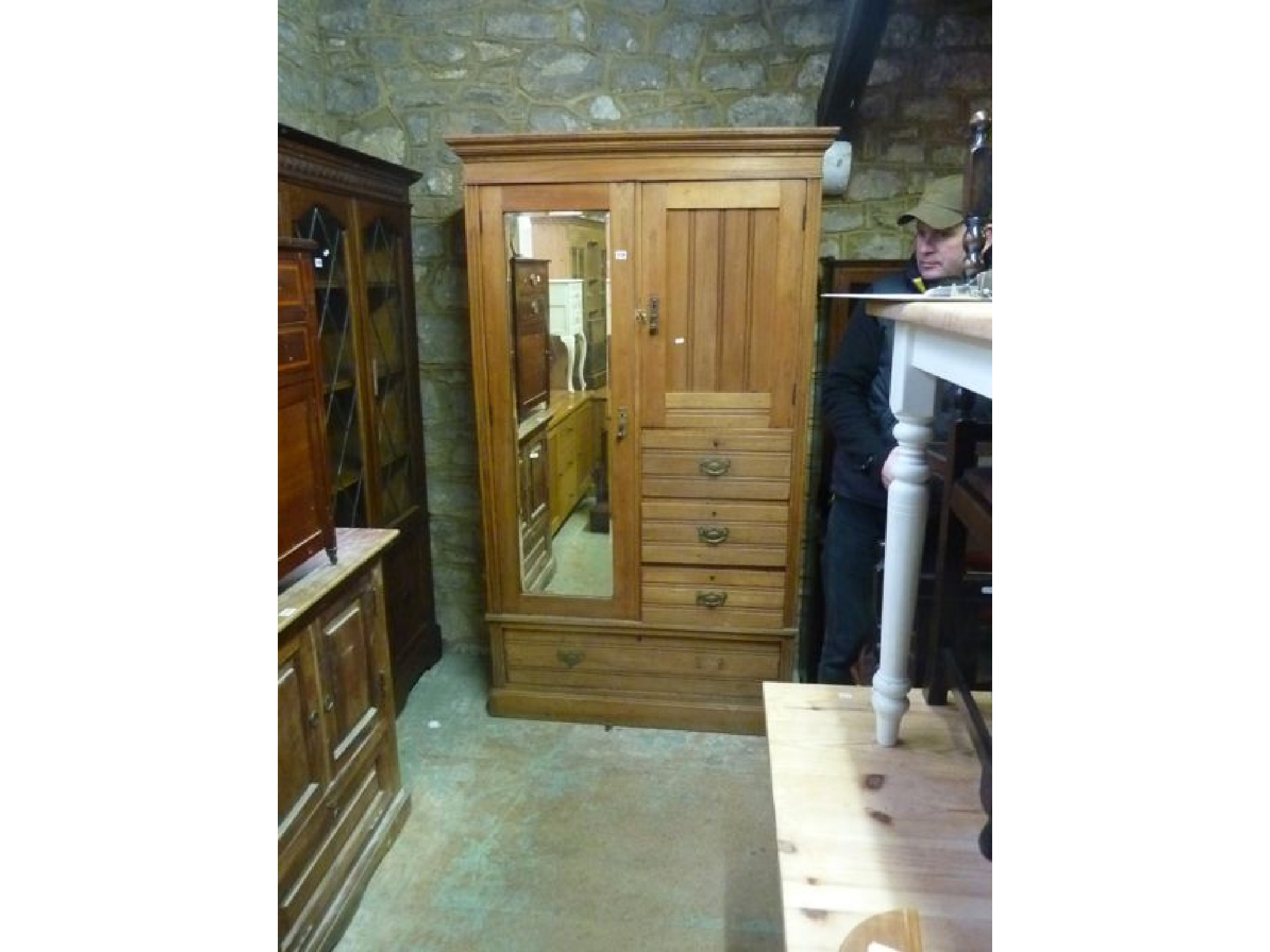 Appraisal: An Edwardian satin walnut compactum wardrobe partially enclosed by a