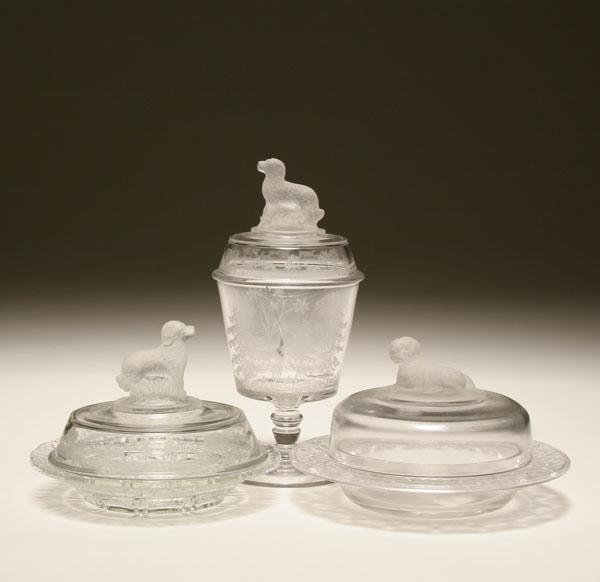 Appraisal: American pressed glass two covered bowls with seated and reclining