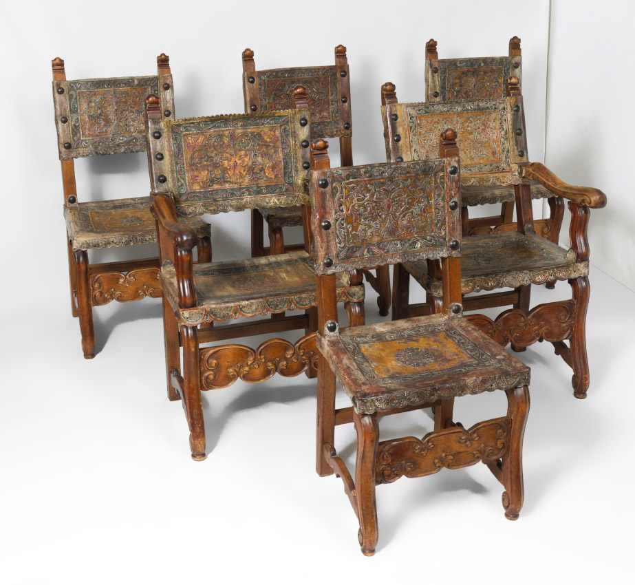 Appraisal: SPANISH BAROQUE TOOLED LEATHER CHAIRS Polychrome paint decorated embossed and