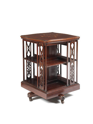 Appraisal: An Edwardian mahogany and fruitwood inlaid revolving bookcase the shaped