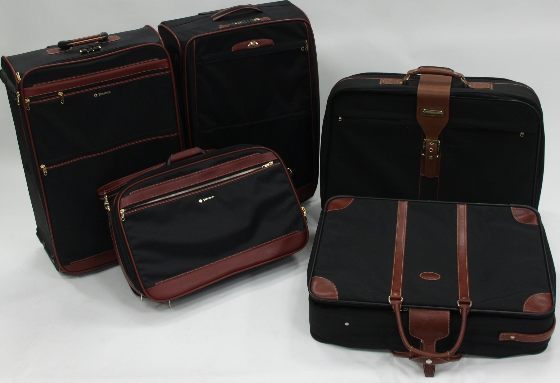 Appraisal: A Longchamp suitcase with leather handles and sundry luggage mostly