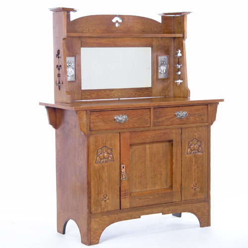 Appraisal: BRITISH ARTS CRAFTS Sideboard with a mirrored backsplash flanked by