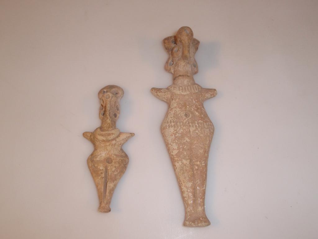 Appraisal: A Cypriote or Anatolian terracotta female figurine or votive broken