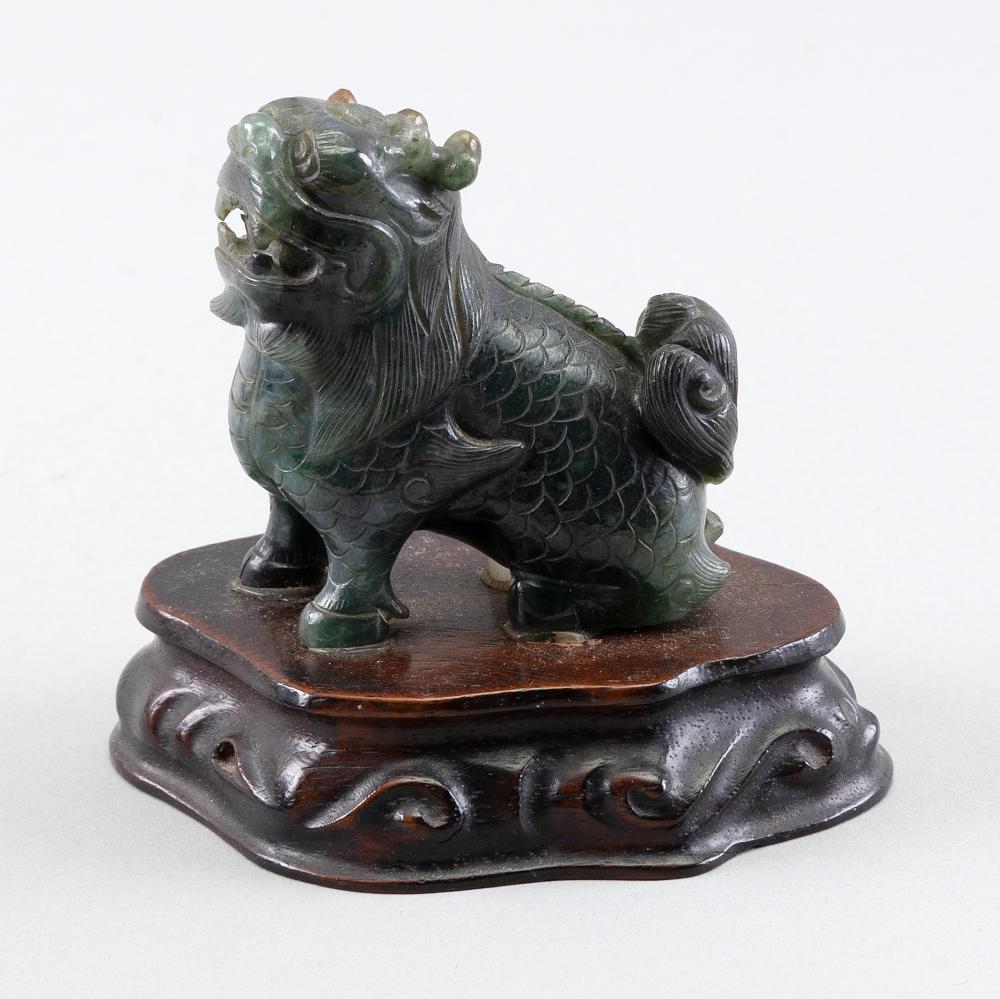 Appraisal: CHINESE CARVED GREEN JADEITE FU DOG HEIGHT HEIGHT ON STAND