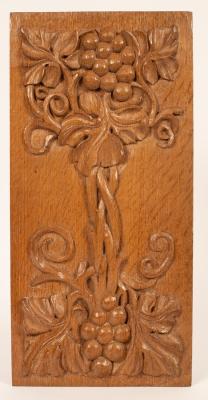 Appraisal: A rectangular oak panel carved grapes and urns in relief