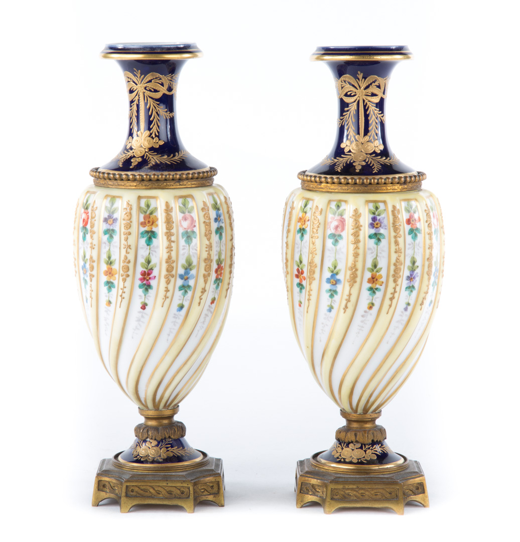 Appraisal: Pair Sevres porcelain urns mid- th century gilt-metal-mounted floral decorated