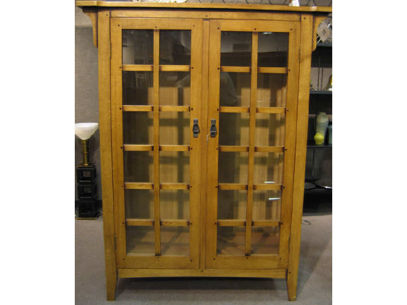 Appraisal: ARTS CRAFTS STYLE CHINA CABINET having two pair of glass