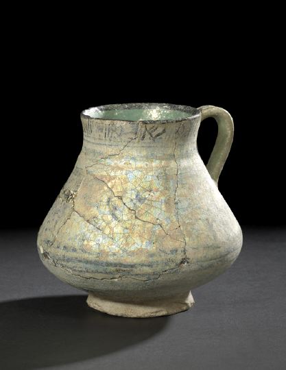 Appraisal: Persian Turquoise- and Black-Glazed Rakka Pottery Jug th- th century