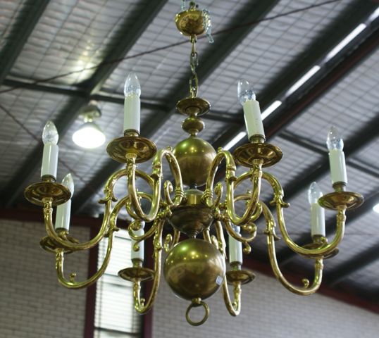 Appraisal: A Dutch style eight light brass chandelier