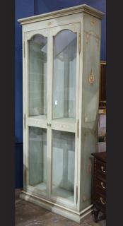 Appraisal: Moderne polychrome and green painted display vitrine having a molded