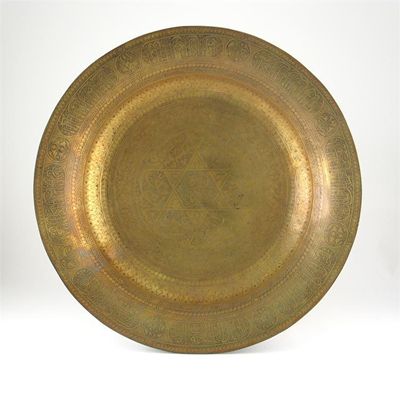 Appraisal: A massive Middle Eastern brass charger engraved with the star