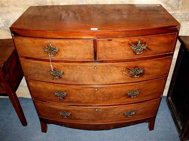 Appraisal: A LATE GEORGE III BOW FRONT MAHOGANY CHEST of two