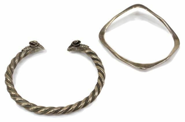 Appraisal: lot of Silver bracelets silver braided bracelet ending in rams