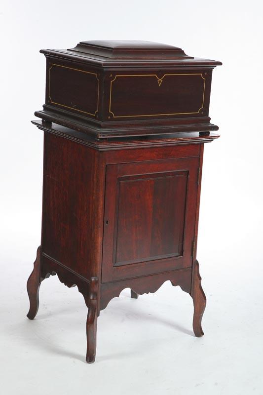 Appraisal: REGINA MUSIC BOX ON STAND Single comb in a mahogany