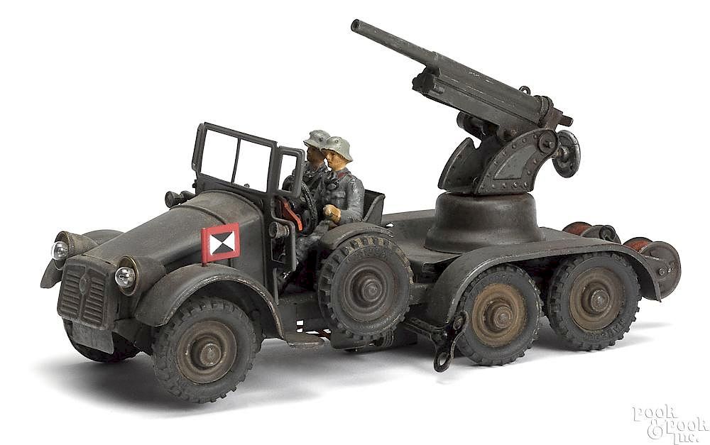 Appraisal: Hausser painted clockwork anti-aircraft gun truck Hausser painted tin clockwork