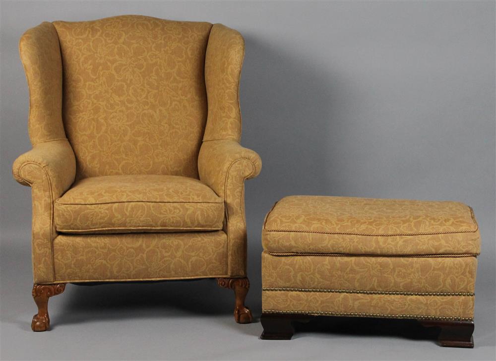 Appraisal: ROSE TARLOW FABRIC UPHOLSTERED WING CHAIR AND COORDINATING OTTOMAN arching