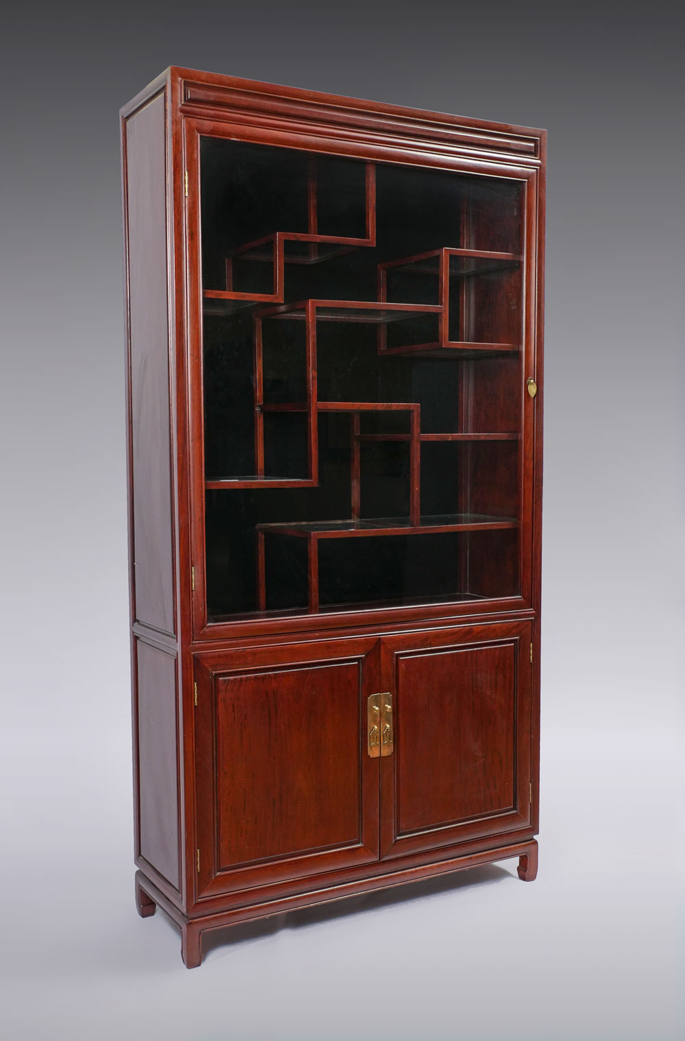 Appraisal: CHINESE DISPLAY CABINET shelf Chinese display cabinet having offset shelves