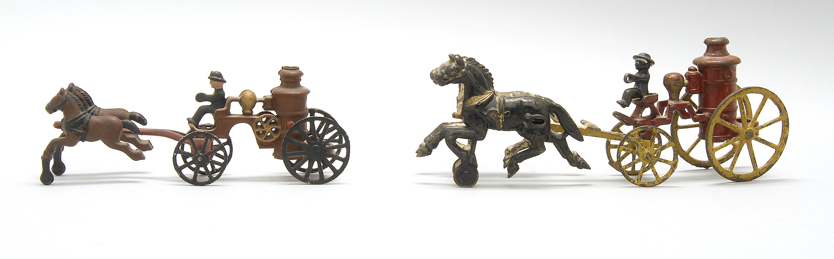 Appraisal: TWO TOY CAST IRON HORSE-DRAWN FIRE PUMPERS Early th Century