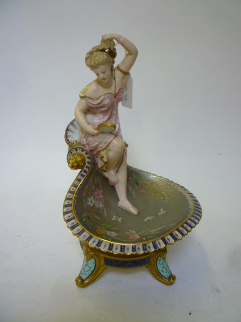 Appraisal: A CONTINENTAL PORCELAIN FIGURAL CENTREPIECE late th century modelled as