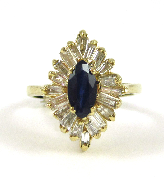 Appraisal: SAPPHIRE DIAMOND AND FOURTEEN KARAT GOLD RING with tapered baguette